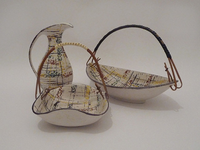 Nr. 1137
Set of three fifties items

Soft white base with coloured grained stripes. 

Wooden handle covered in a plastic brown and white ribbon 

[b]Uebelacker Keramik[/b]

Model 561, 565 and 398 

Made in 1957

Good vintage condition, vase has a reglued handle

H 15,5 cm x W 15 cm

20 euro

[url=https://kosai.be/gallery/contact.php?referer=index.php][img]https://kosai.be/gallery/varia/buy.jpg[/img][/url]


[img]https://www.kosai.be/images/1137.jpg[/img]


[img]https://www.kosai.be/images/1137_5lr.jpg[/img]


[img]https://www.kosai.be/images/1137_6lr.jpg[/img]


[img]https://www.kosai.be/images/1137_7lr.jpg[/img]


[img]https://www.kosai.be/images/0505.jpg[/img]


[img]https://www.kosai.be/images/0505_4lr.jpg[/img]


[img]https://www.kosai.be/images/0505_6lr.jpg[/img]


[img]https://www.kosai.be/images/1576.jpg[/img]


[img]https://www.kosai.be/images/1576_5lr.jpg[/img]


[img]https://www.kosai.be/images/1576_7lr.jpg[/img]


[img]https://www.kosai.be/images/1576_9lr.jpg[/img]


[url=https://kosai.be/gallery/contact.php?referer=index.php][img]https://kosai.be/gallery/varia/buy.jpg[/img][/url]


[url=https://kosai.be/gallery/displayimage.php?pid=56]Back to top[/url]
Keywords: U Keramik